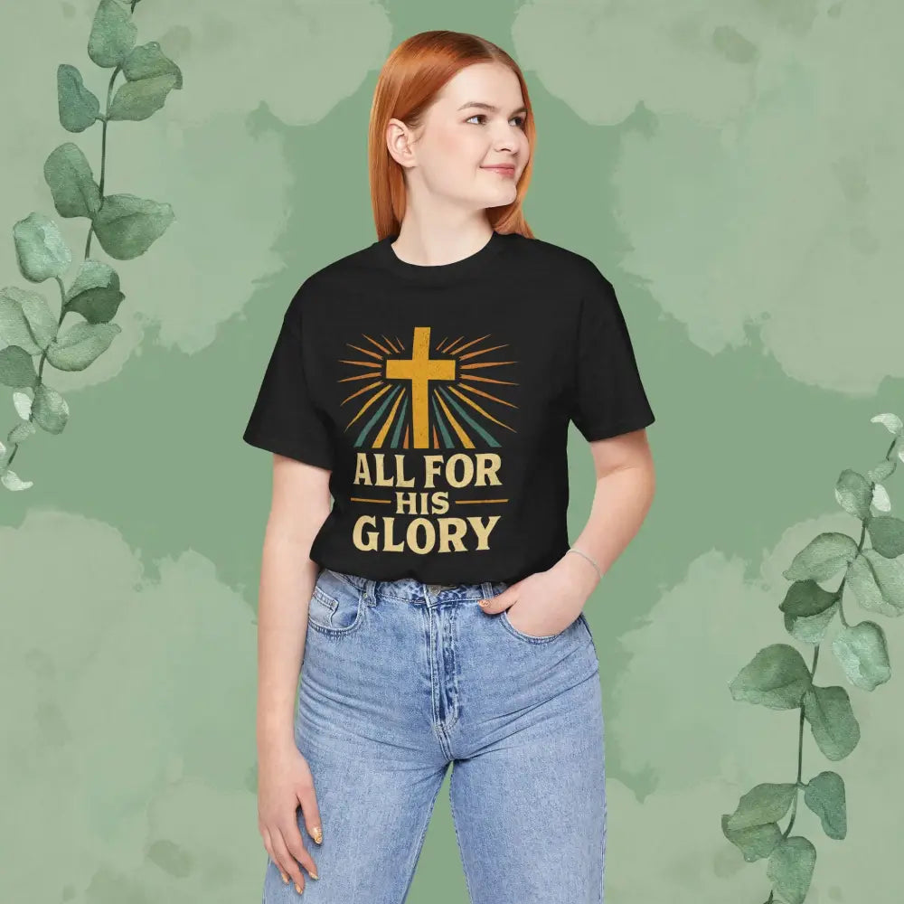 Person wearing a black t-shirt with a cross and 'All for His Glory' text on a green background