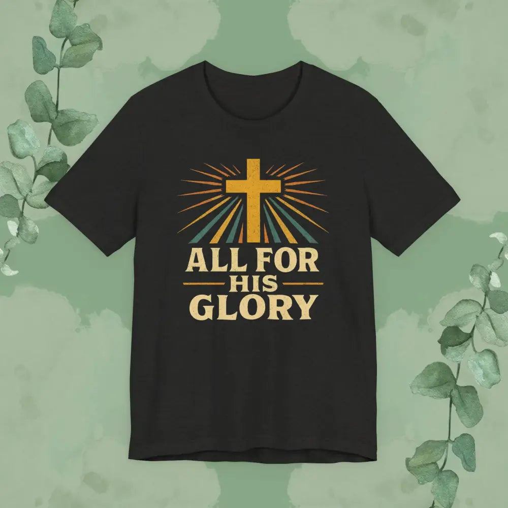 Black t-shirt with a cross and 'All for His Glory' text on a green leafy background