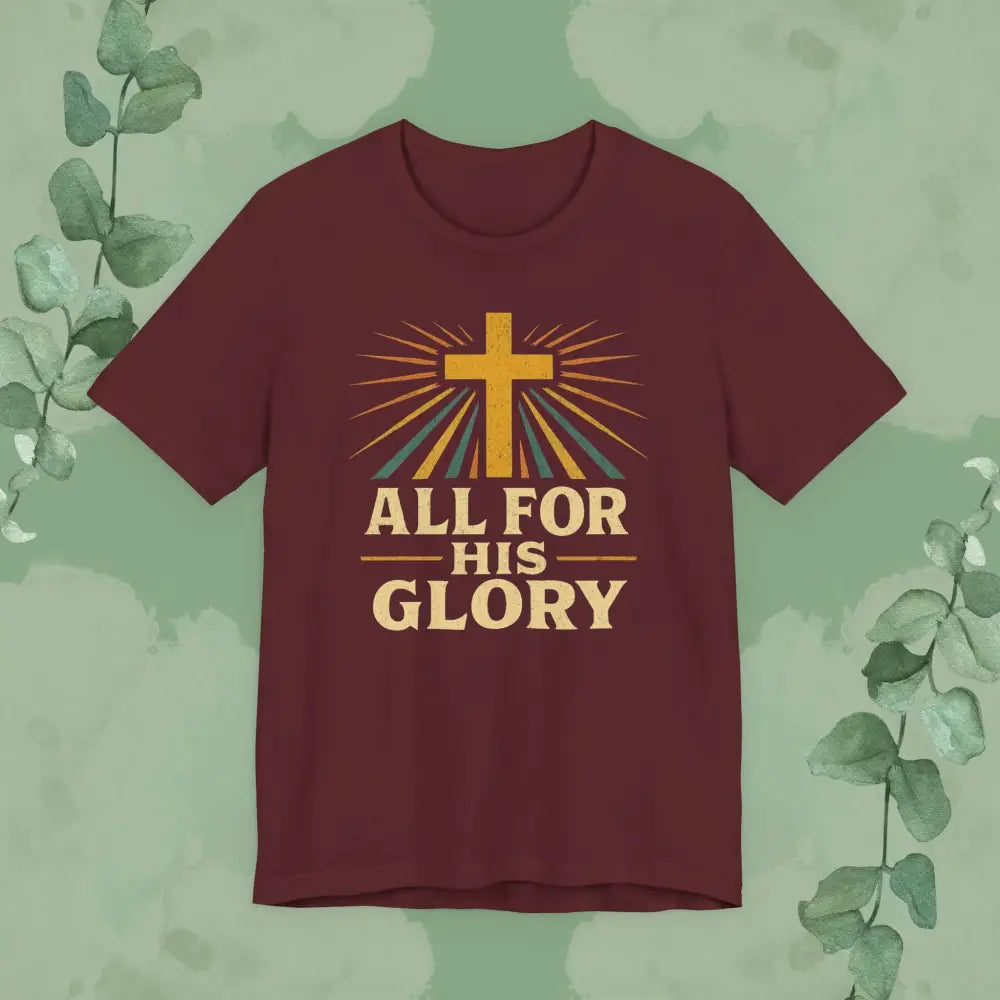 Maroon t-shirt with a cross and 'All for His Glory' text on a green background with leaves.
