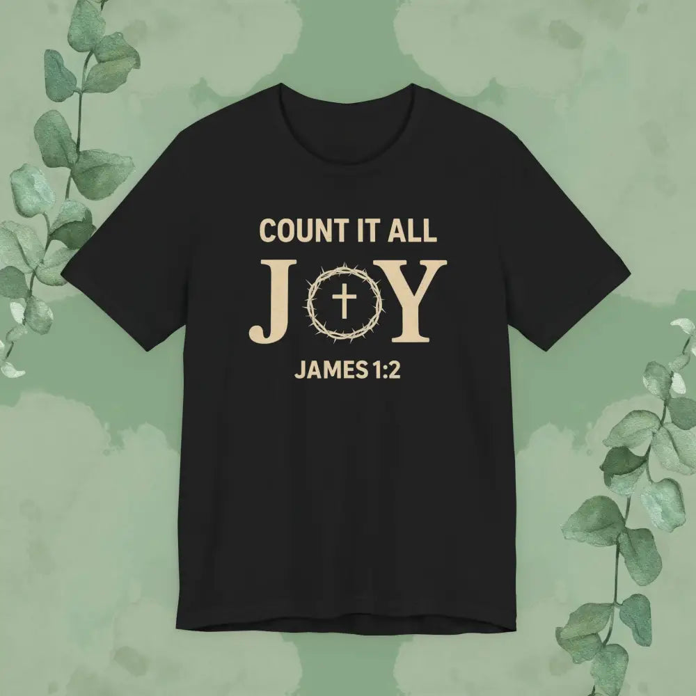Black t-shirt with 'Count it all JOY James 1:2' text on a green background with eucalyptus leaves.