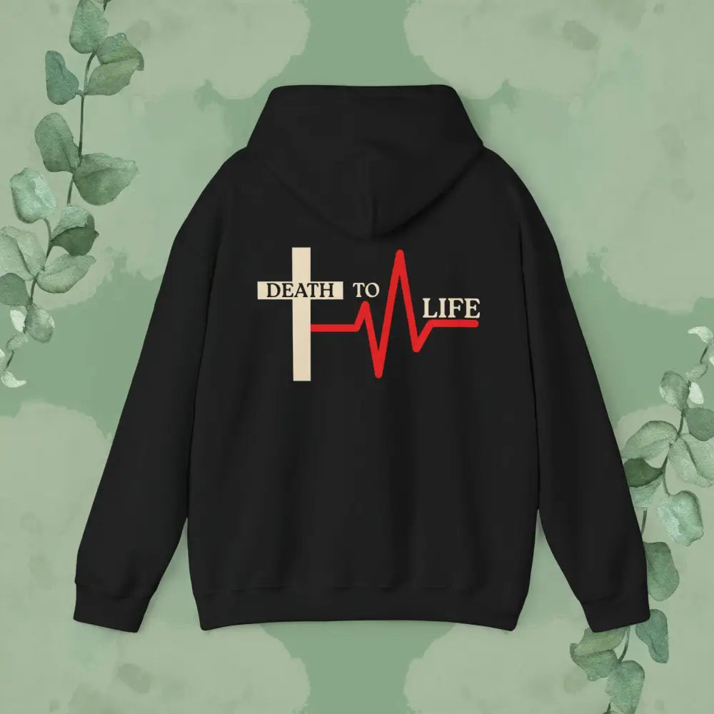 Black hoodie with 'Death to Life' design on a green leafy background
