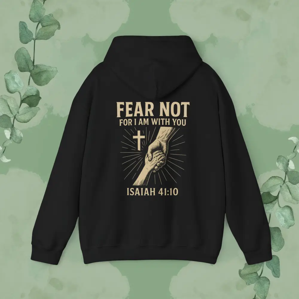Black hoodie with 'Fear Not' text and hand holding cross design on a green leafy background