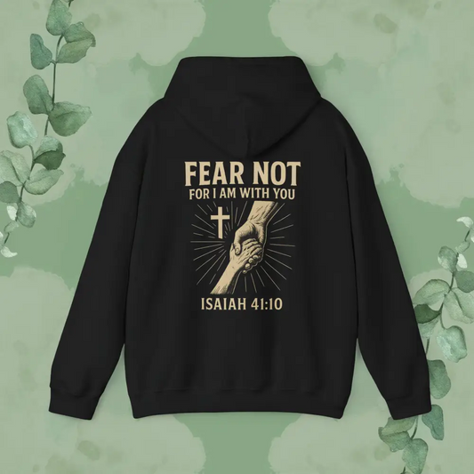 Black hoodie with 'Fear Not' text and hand holding cross design on a green leafy background