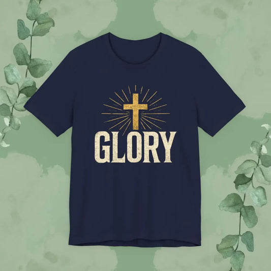 Navy blue t-shirt with a gold cross and 'GLORY' text on a green leafy background