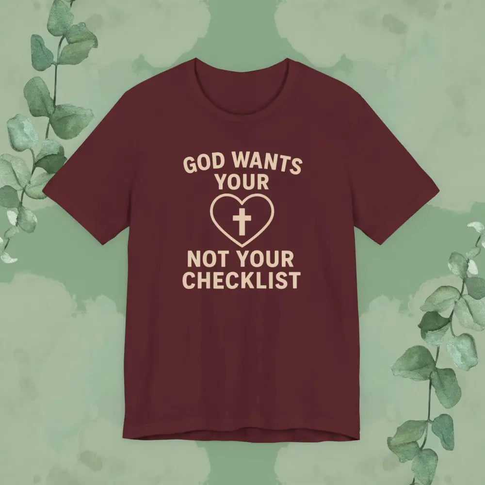 Maroon t-shirt with text and heart design on a green background