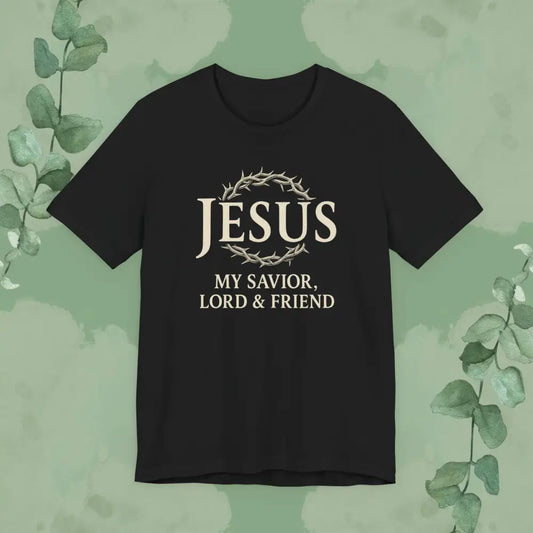 Black t-shirt with 'Jesus My Savior, Lord & Friend' text on a green background with leaves.