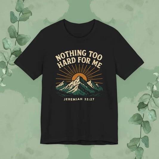 Black t-shirt with mountain design and text on a green background
