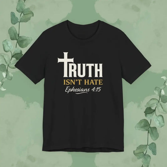 Black t-shirt with 'Truth Isn't Hate' text and cross design on a green leafy background