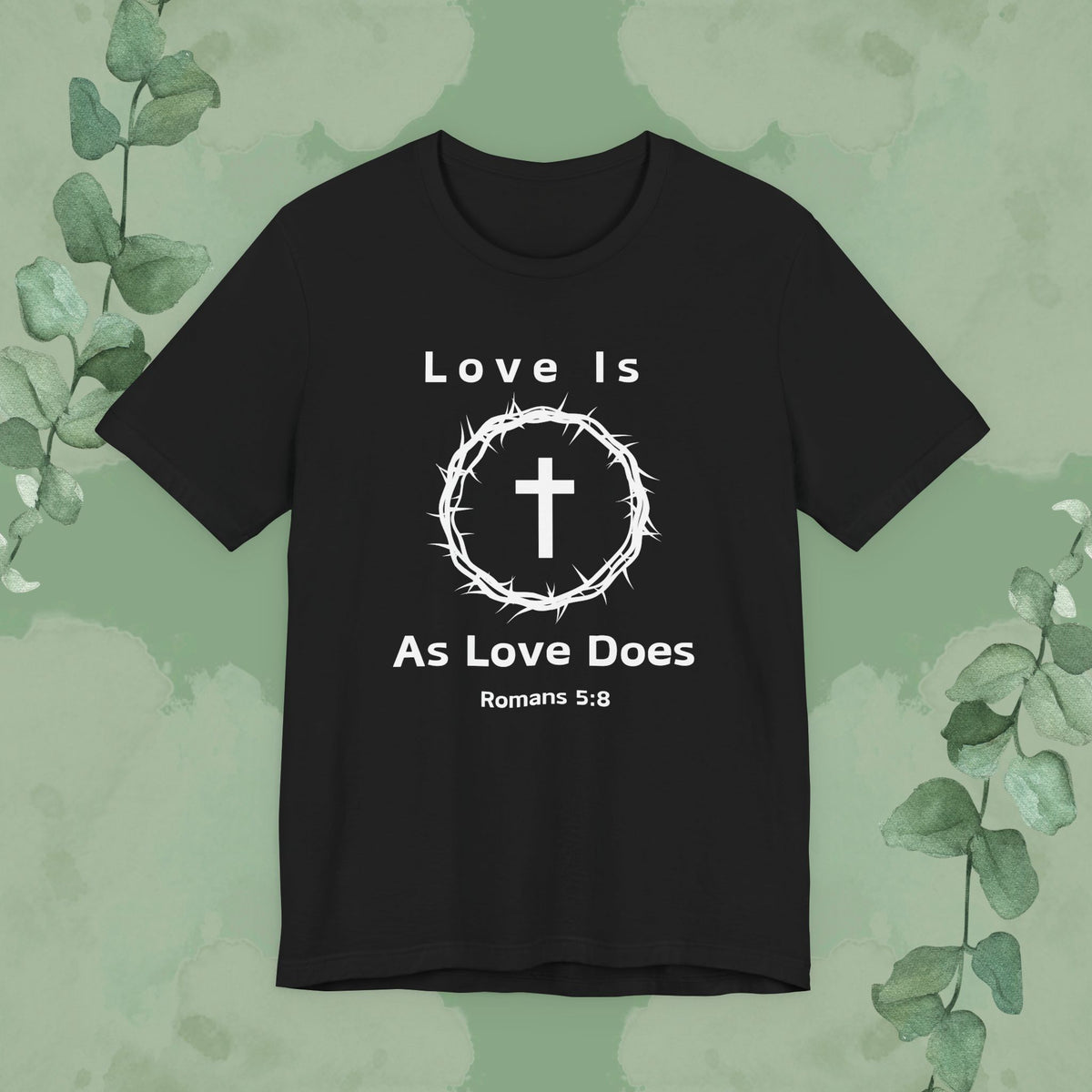 “Love Is As Love Does” Romans 5:8 Christian T-Shirt – Crown of Thorns Cross Design