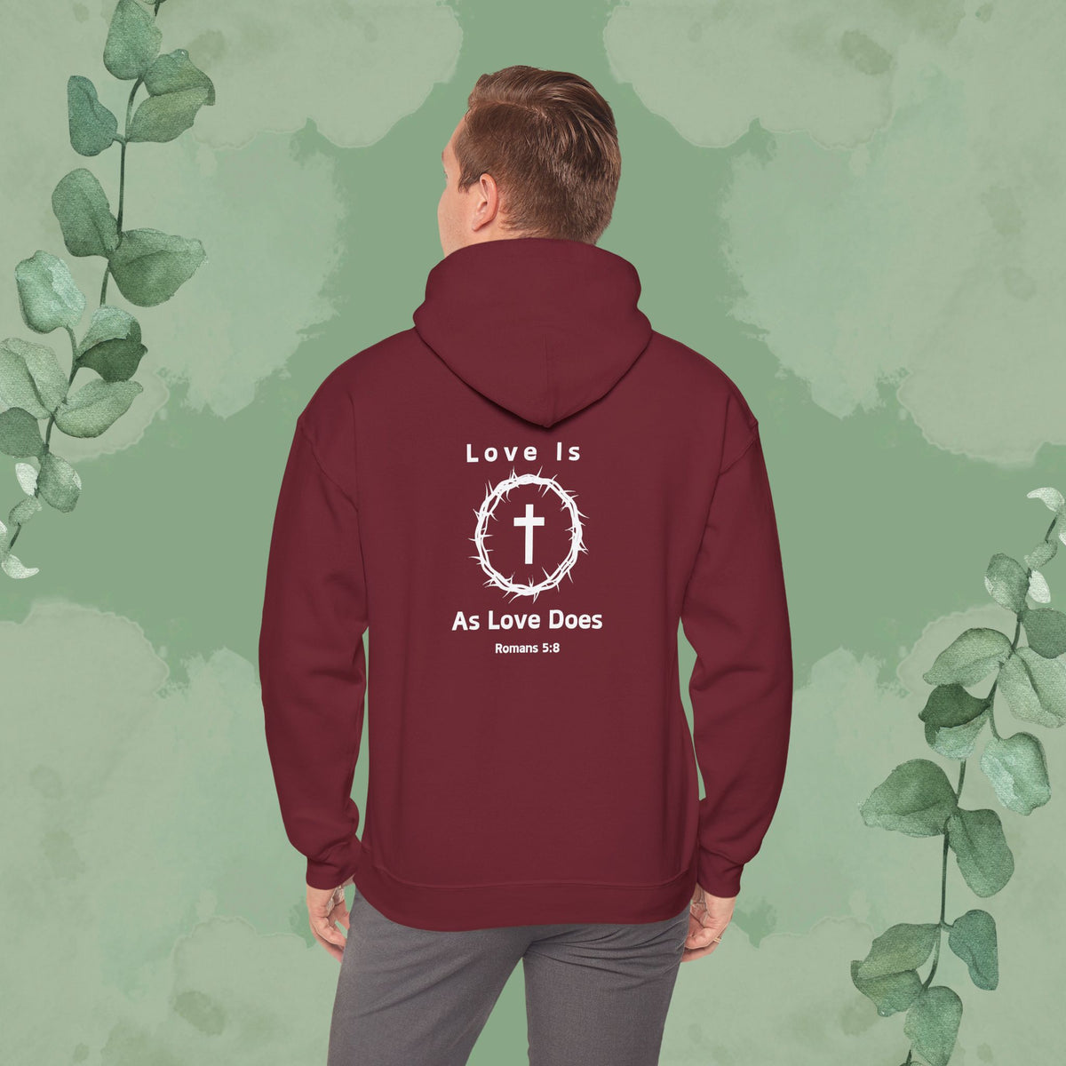 Maroon Christian hoodie with “Love Is As Love Does” Romans 5:8 design