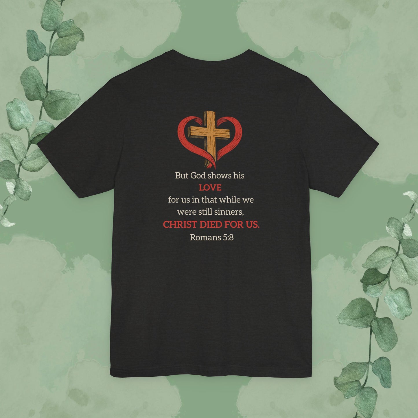 Black Heather Back Christian T-shirt with “While We Were Still Sinners” Romans 5:8 design