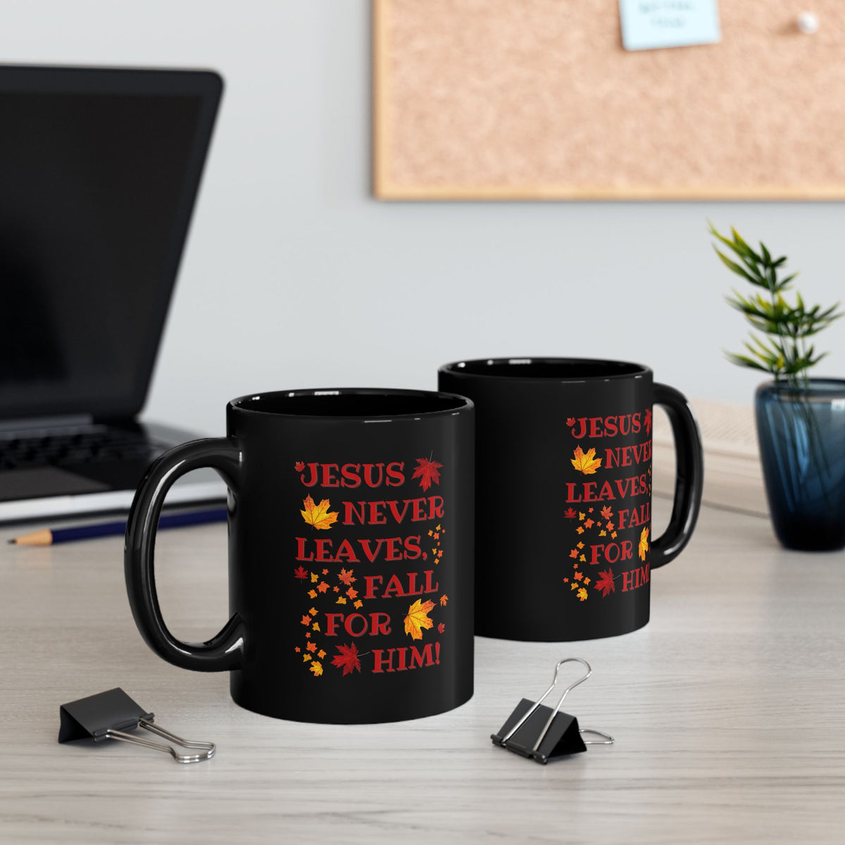 Black Christian mug with “Jesus Never Leaves, Fall for Him” autumn faith design