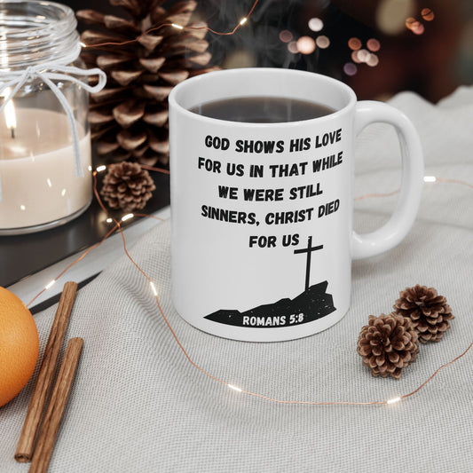 White Christian mug with “Christ Died for Us” Romans 5:8 scripture design
