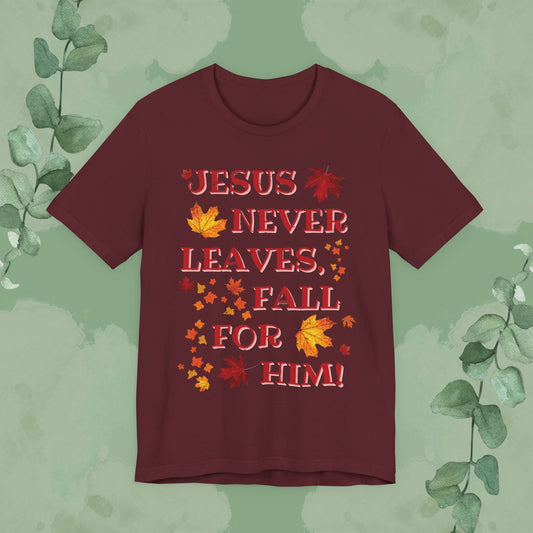 Maroon Christian T-shirt with “Jesus Never Leaves – Fall for Him!” autumn faith design