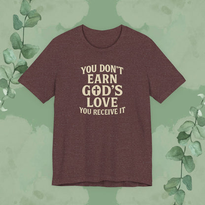 Heather Cardinal Christian T-shirt with “You Don’t Earn God’s Love – You Receive It” design