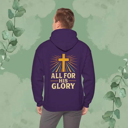 Person wearing a purple hoodie with 'All for His Glory' text and cross design on the back, against a green leafy background.