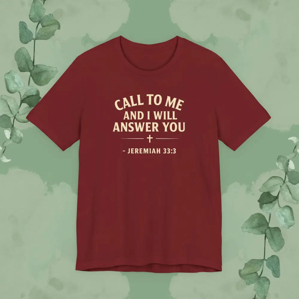 Red t-shirt with white text on a green background with leaves
