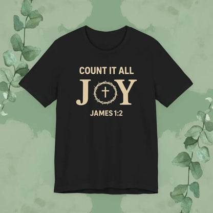 Black t-shirt with 'Count it all JOY James 1:2' text on a green background with eucalyptus leaves.