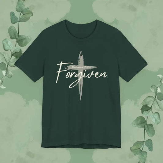 Forest green Christian T-shirt with a light brush-stroke cross and the word “Forgiven” across it, featuring Colossians 2:13-14, designed by True Vine Design.