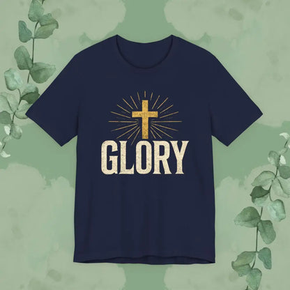 Navy blue t-shirt with a gold cross and 'GLORY' text on a green leafy background