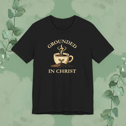 Black t-shirt with 'Grounded in Christ' design featuring a coffee cup and plant on a green background.
