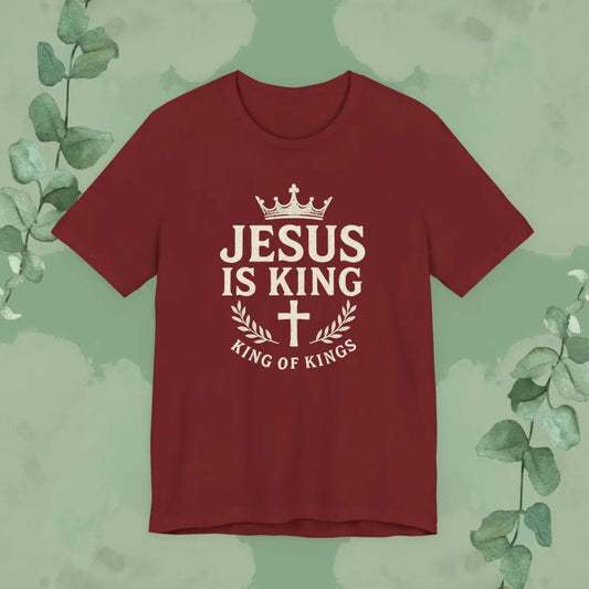 Red Christian t-shirt featuring “Jesus Is King” design with crown, cross, and the words “King of Kings.”