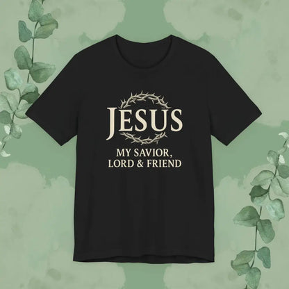Black t-shirt with 'Jesus My Savior, Lord & Friend' text on a green background with leaves.