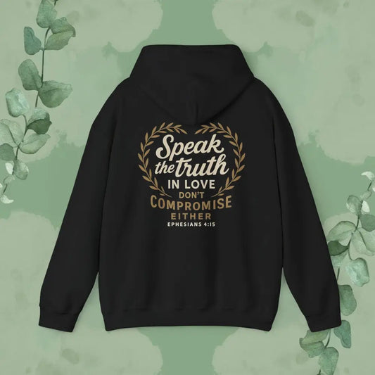 Black hoodie with text on the back against a green leafy background