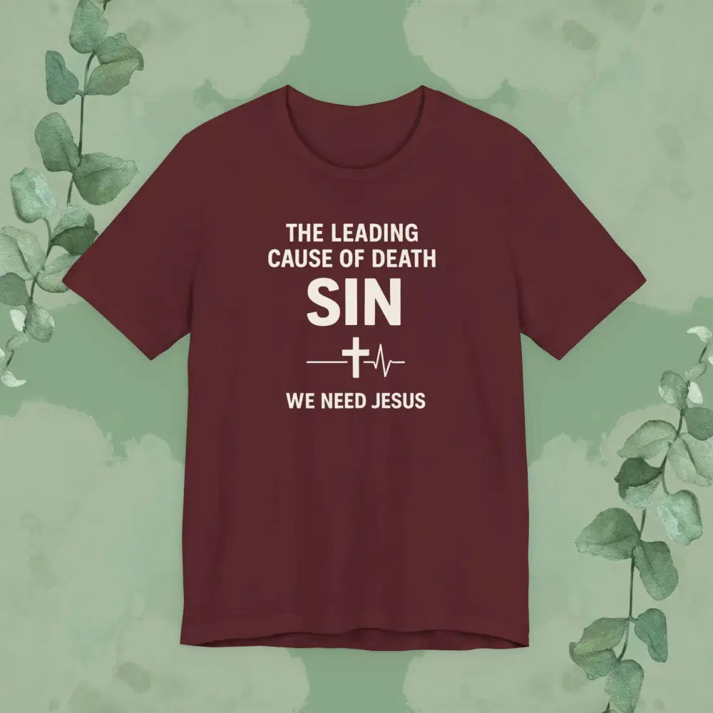 Maroon t-shirt with text on a green background