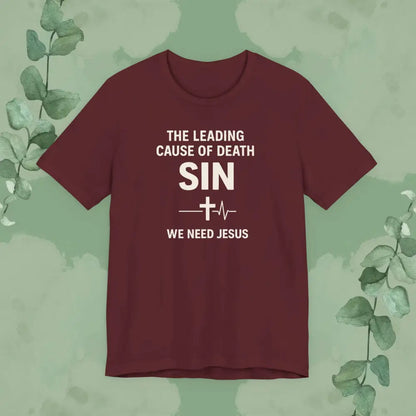 Maroon t-shirt with text on a green background