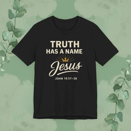 Black t-shirt with 'Truth Has a Name Jesus' text on a green background